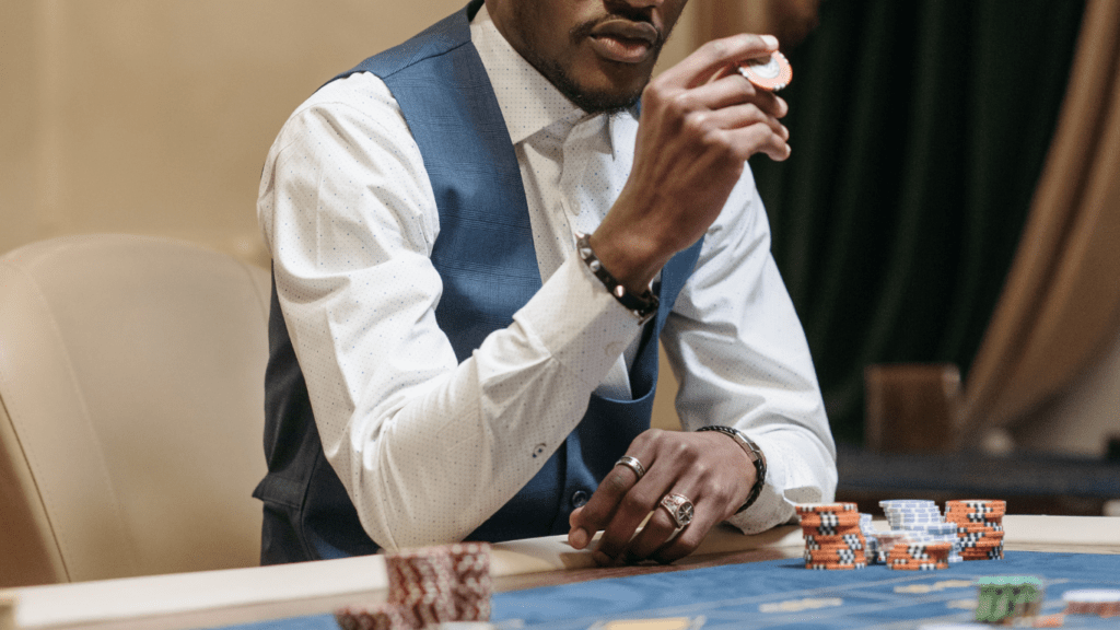 Person holding a 1000 casino chips