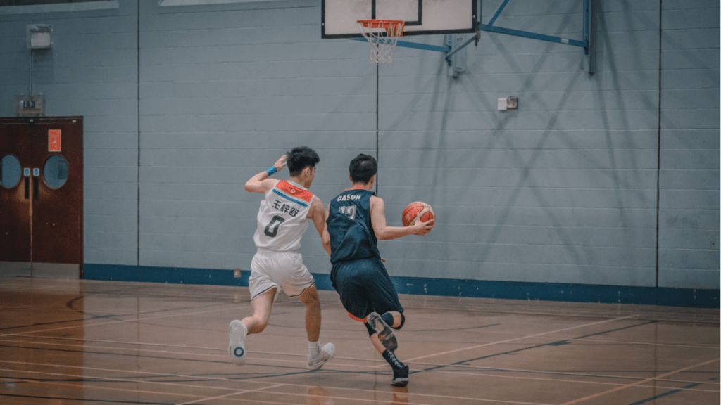 Two men playing basketball