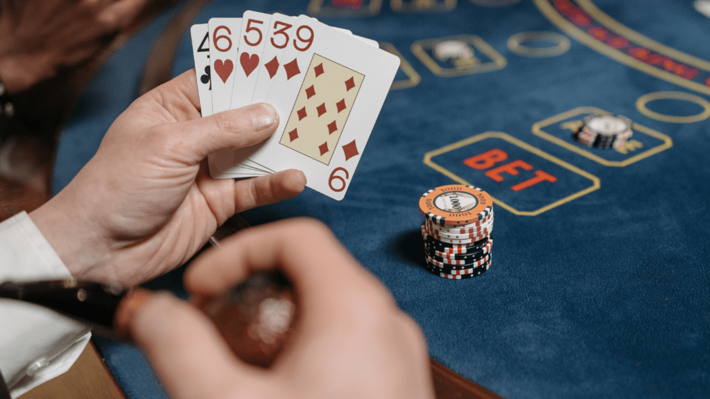 Holding playing cards at casino table